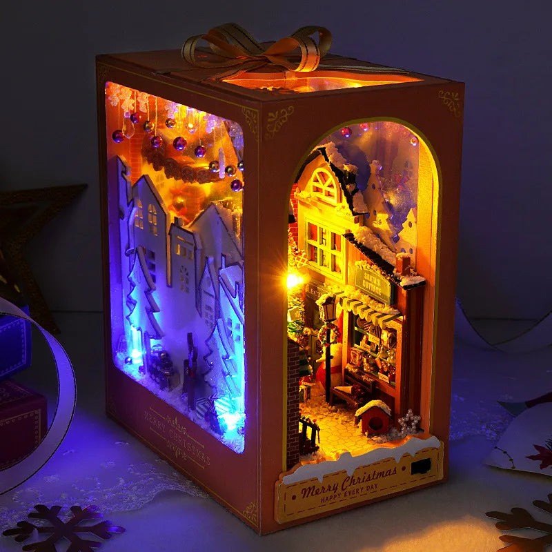 Christmas Cabin Book Nook Kit — a tiny lit Christmas cabin tucked between your books